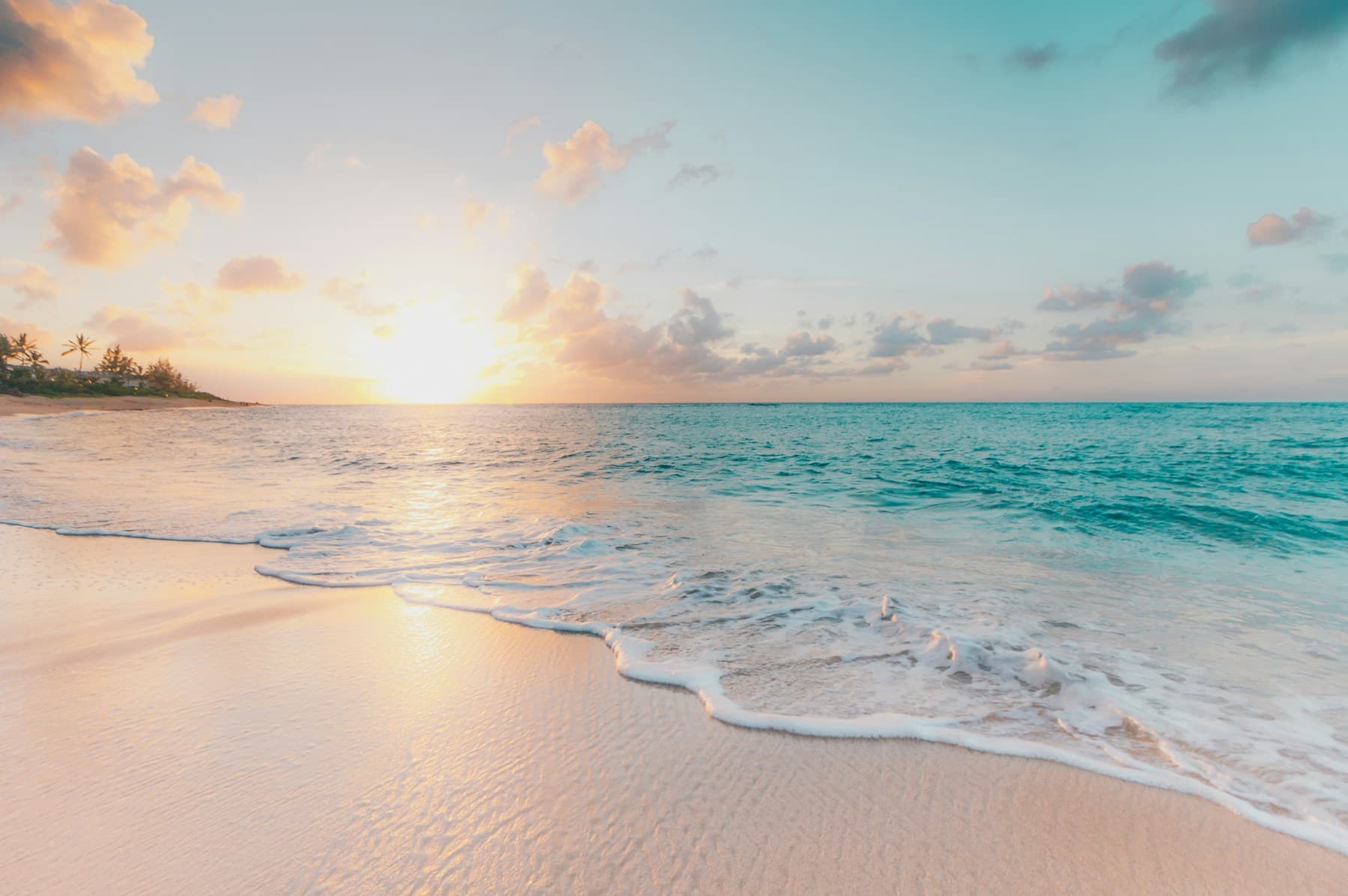 Sunlit beach and turquoise water for private coastal leisure planning